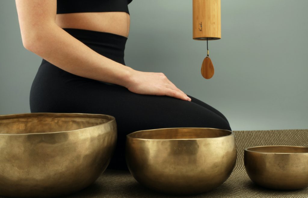 Vancouvers ound healing practitioner playing himalayan tibetan singing bowls and koshi chimes.