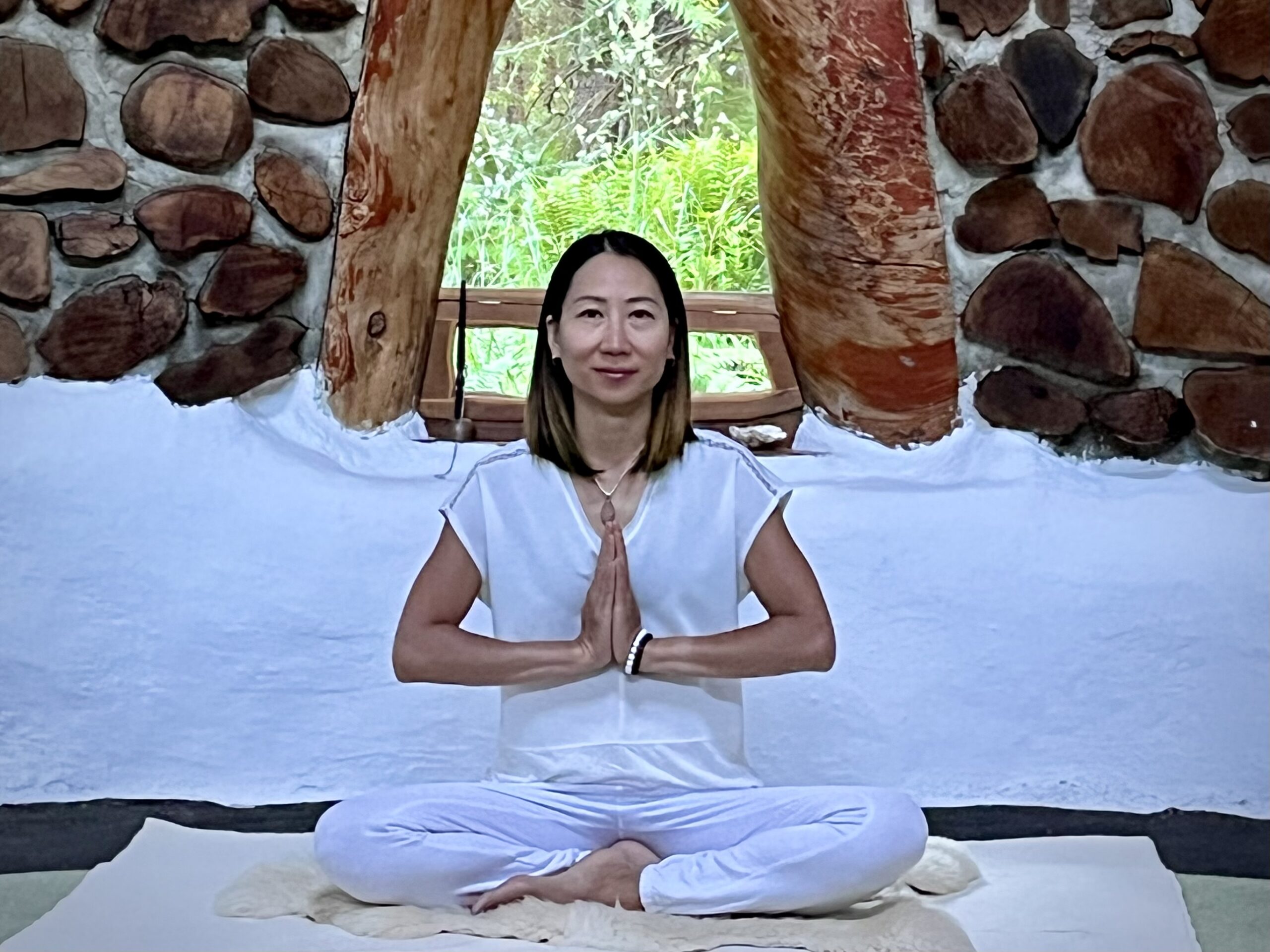 Vancouver yogi sitting in meditative posture teaching Kundalini Yoga class.